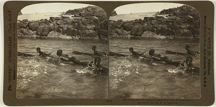 Nubian Boys Shooting the Rapids of the Nile on Logs, Egypt