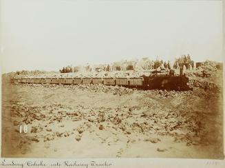 Pampa and oficina views. Loading Caliche into railway trucks